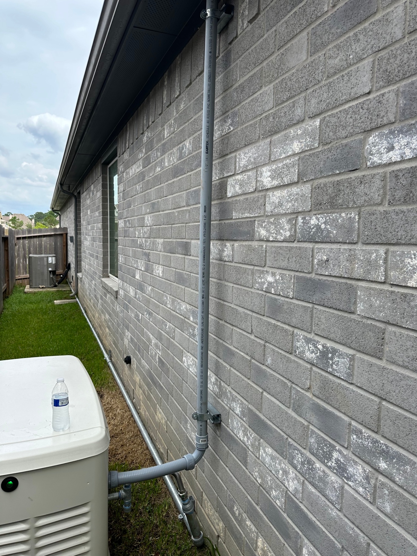 Code-Compliant Conduit Run to Generator Pad — Houston, TX