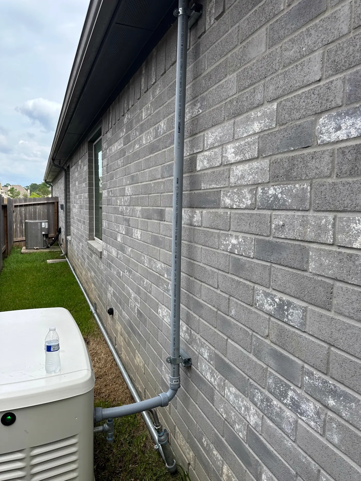 Code-Compliant Conduit Run to Generator Pad — Houston, TX